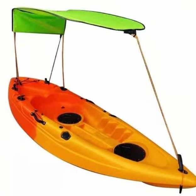 Bimini top for sit on top kayak with fishing rod holders attached to sun  shade support poles.